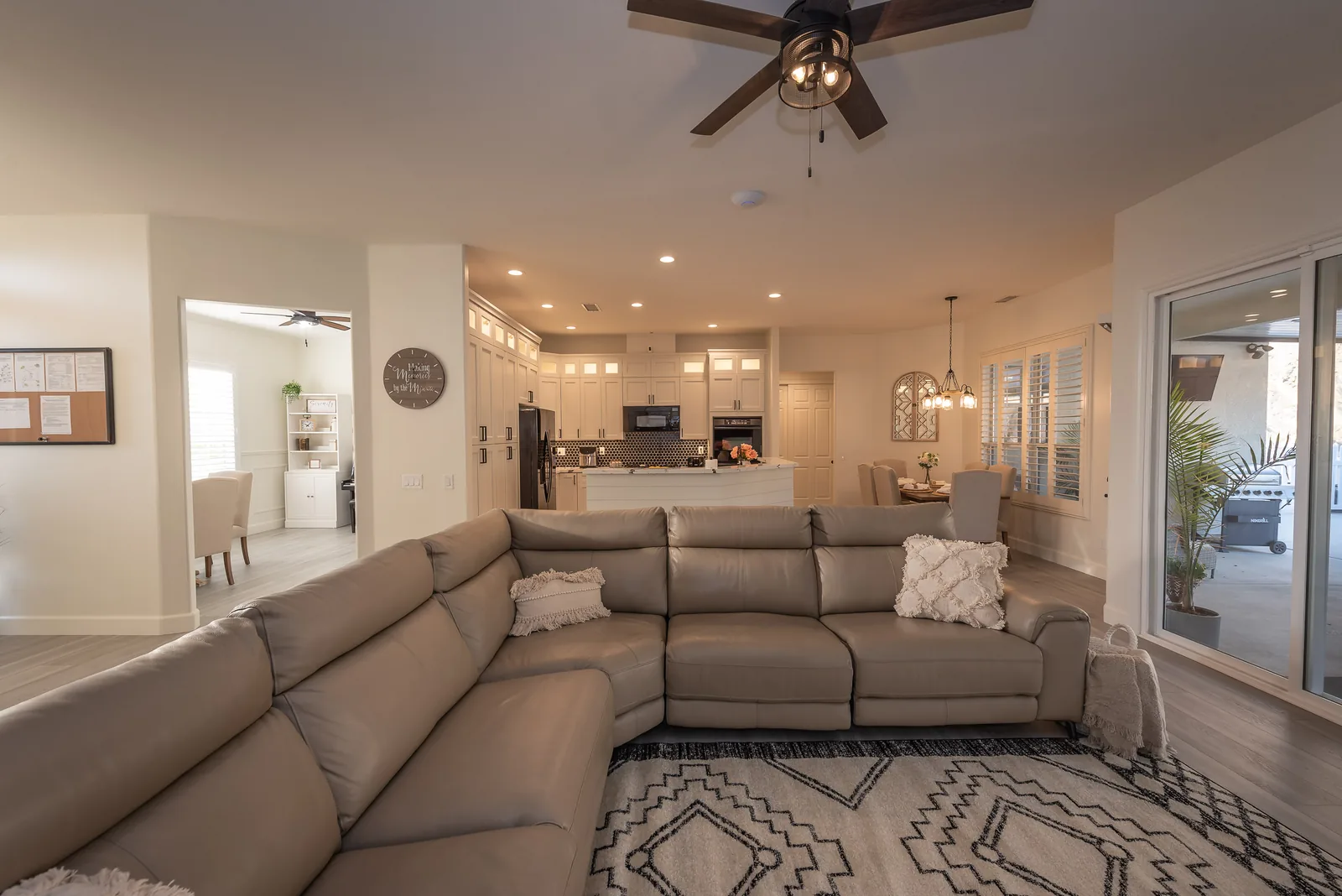 Living room with mountain view through picture window at Manitou Home, Corona, California